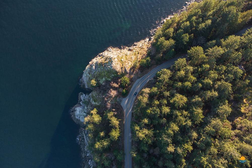 Gower Point Road passing Gospel Rock in Gibsons, BC