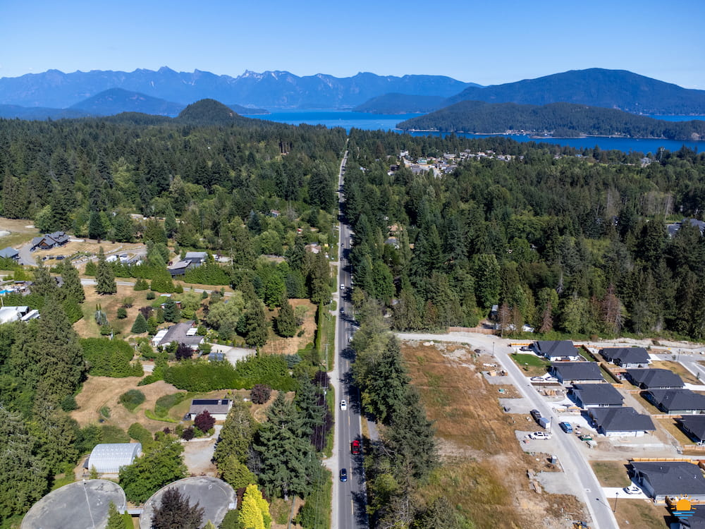 Aerial view of Reed Road in Gibsons, BC. North Shore Mountains are in the distance.